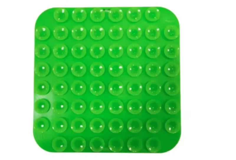 Dos du tapis de léchage couvert de ventouses