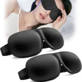 Deux masques de sommeil 3D noirs, avec une femme endormie portant le masque en arrière-plan